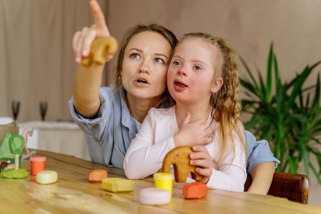 caregiver and young girl looking